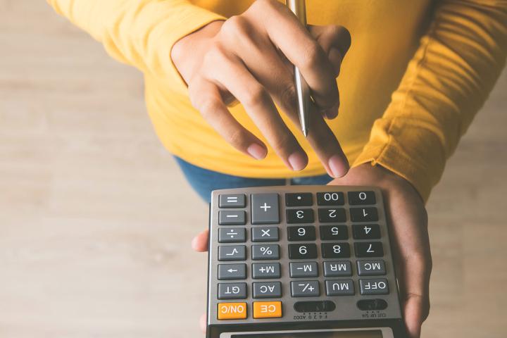 Woman holding calculator