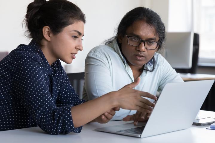 Two people watching an online video together