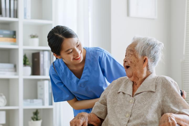 Care aide with senior resident