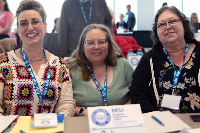 three HEU members sitting at a table